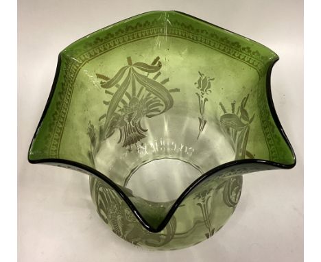 A green glass oil lamp shade. Est. £20 - £30.