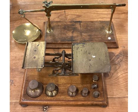 Two sets of Antique brass postal scales. Est. £30 - £40.