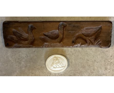 A carved wooden panel depicting three birds together with an intaglio. PROVENANCE: NOEL CHANAN. Est. £20 - £30. 