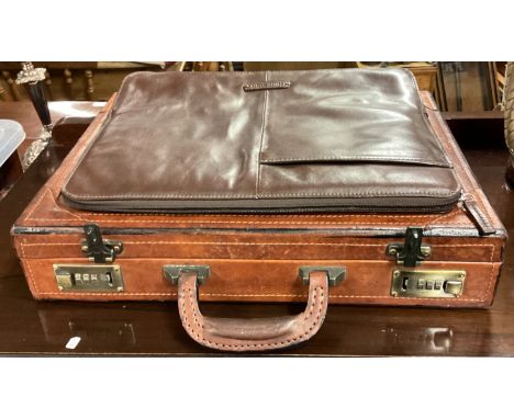 A good brown leather briefcase together with one other. Est. £20 - £30.