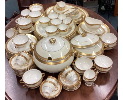 A good quality Minton dinner service with gilded rim together with a matched Royal Worcester 'Durham' part dinner service. Es