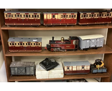 A good 16mm narrow gauge model steam engine entitled 'Russell' complete with rolling stock etc. Est. £100 - £150.