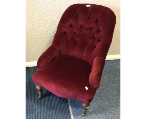A Victorian button back nursing chair. Est. £30 - £50.
