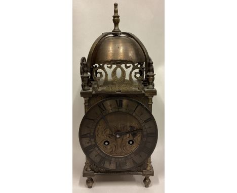 An old brass lantern mantle clock. Est. £50 - £80.