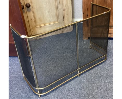 A brass mounted fire screen. Est. £30 - £50.