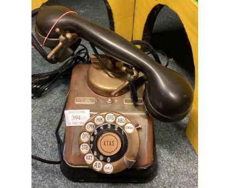 A vintage telephone. Est. £20 - £30.