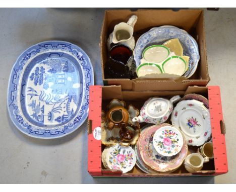 A quantity of decorative ceramics to include a large willow pattern meat plate, a salt glazed jug, 19th century plates and a 