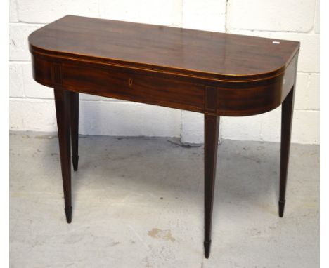 A 19th century mahogany inlaid fold-over card table on tapering supports and peg feet, diameter when extended 86cm, height 74