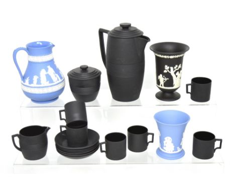 A Wedgwood black basalt coffee service by Keith Murray to include a coffee pot, sucrier, milk jug, six coffee cans and six sa