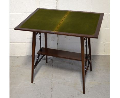 A reproduction mahogany side table with lower shelf on turned supports, on tapering splayed legs, 69 x 60cm.