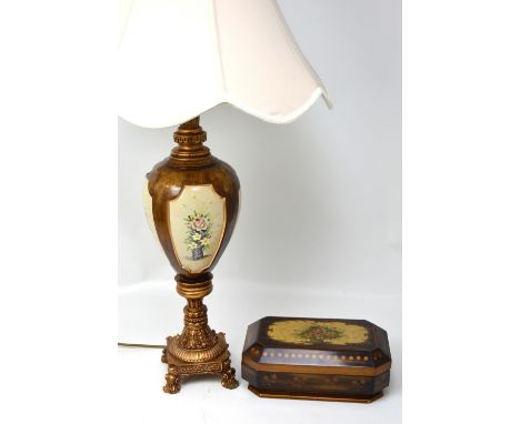 A treen baluster shape table lamp with inset ceramic panels with floral decoration, on a gilded base and an Italian style tre