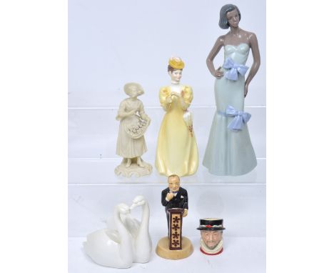 A Royal Doulton small character jug D6251 'Beefeater', a Nao figure of a lady in evening dress, a Copeland figure of a lady i