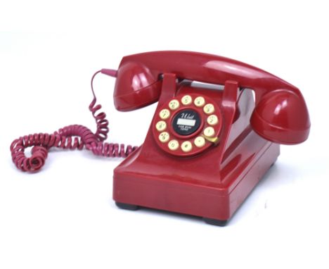 A vintage red telephone.