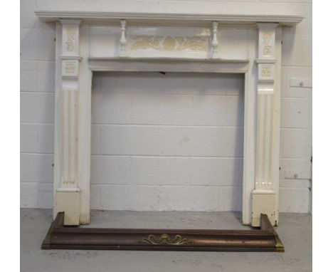 A cream painted wooden fire surround, width 163cm and a fire fender, width 138cm (2).