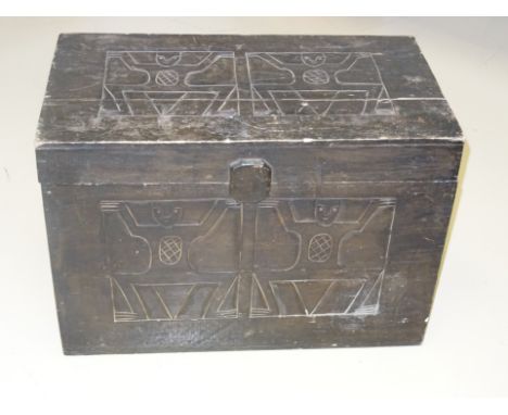 An ebonised figured trunk