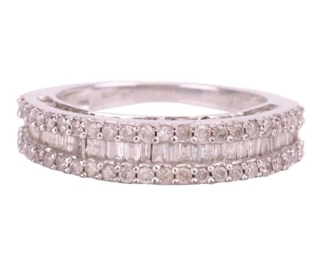 A diamond-set ring, featuring baguette-cut diamonds flanked by two rows of round brilliant diamonds, in a 9ct white gold moun