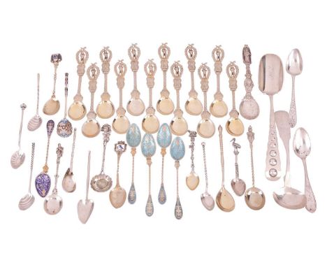 



A mixed quantity of teaspoons and souvenir spoons, comprising twelve gilt souvenir spoons featuring terminals depicting N