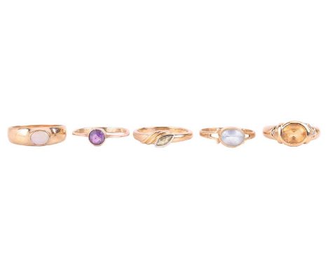 Five gem-set dress rings, comprising an opal ring, size O1/2, a blue topaz ring, size O, an amethyst ring, size N, a peridot 