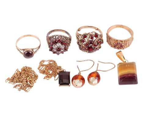 A small collection of jewellery items including a garnet-set floral bombé-style ring, size M with sizing beads, a bark-style 