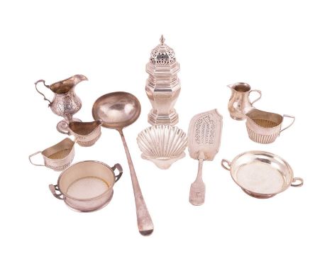 A mixed group of silver comprising a George III soup ladle, a William IV fish slice with pierced grille and engraved crest to