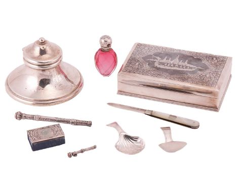 A collection of items comprising a Niello cigar box, stamped 'Sterling', a silver capstan inkwell, two silver propelling penc