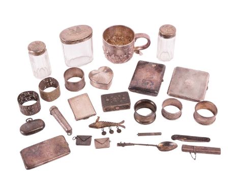 A mixed collection of silver and plate comprising a silver mug, two silver cigarette cases, a silver match case, a silver car