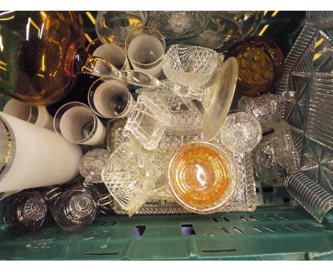 A large collection of glass ware to include cut glass trinket dishes, serving plates and similar