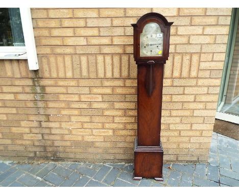 A mahogany cased grandaughter clock, the case styled in distinct areas of hood, trunk and base, accented by Art Deco styled a