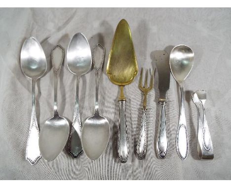 A collection of German hallmarked silver tableware, marked .800, to include four spoons, silver handled cake slice, knife, fo