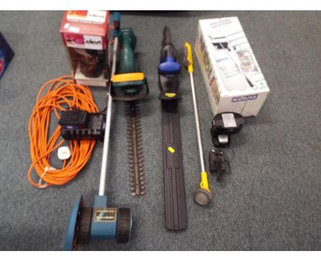 A collection of garden tools to include a Hozelock pressure spray (boxed & unused), a MacAllister hedge trimmer Model No. MHT