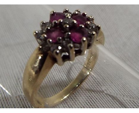 A lady's 9ct gold ring set with diamonds and ruby, size I, approximate weight 2.46 grams (all in) - Est £60 - £80