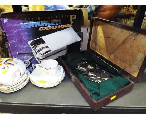 A smoker cooker, boxed, a leather bound box containing silver plated flatware and a quantity of Royal Standard tableware