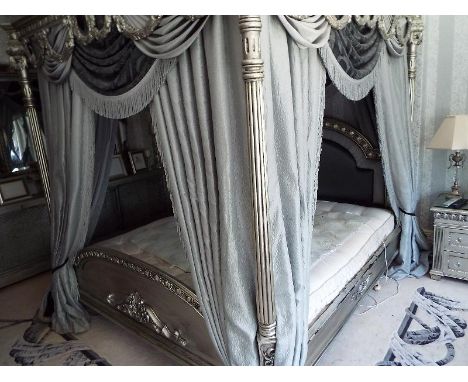 A substantial Four poster bed with ornate silvered decoration throughout -  to include all soft furnishings, approx measureme
