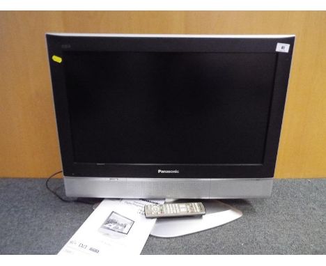 A Panasonic digital progressive LCD television, Model TX-26LXD50, with manual and remote
