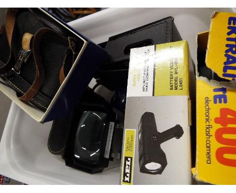 A good mixed lot of photographic equipment to include a Kodak Ektralite, a DC Super Compact video light, Ziess Ikon, binocula