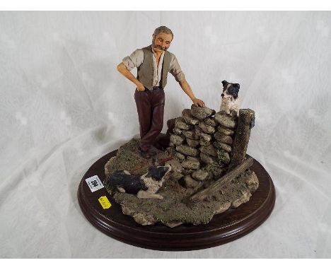 A Country Artists ceramic figurine depicting a gentleman with his dogs, set on a wooden plinth, signed K. Sherwin, 28cm (h) x