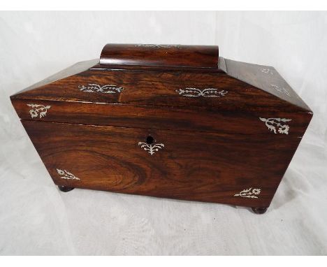A sarcophagus shaped tea caddy with mother-of-pearl inlaid floral and foliate decoration, 20 cm x 31 cm x 16 cm 