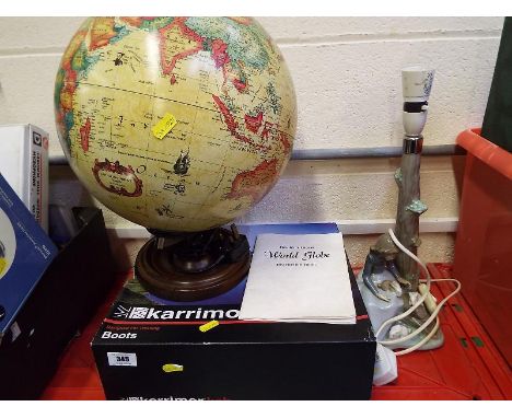 An electric World globe, a steamer and a Nao ceramic lampstand