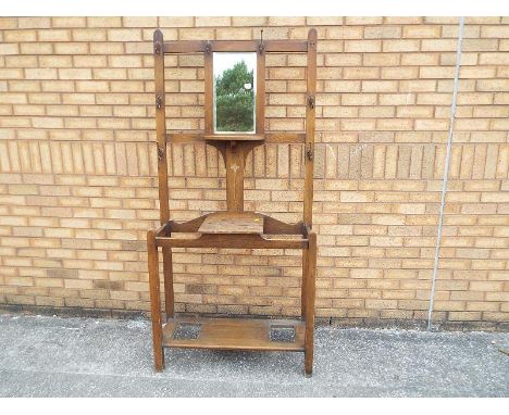 An oak hall stand with integral mirror 190cm (h) x 90cm (w) x 31cm (d)