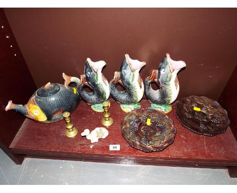 An unusual teapot with matching glug jugs in the form of fish, carnival glass, candlesticks and other