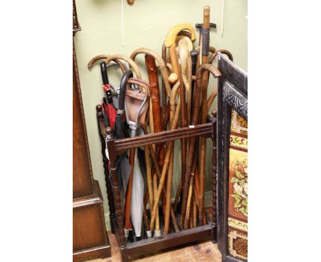 Oak bobbin leg stick stand and collection of sticks and brollies