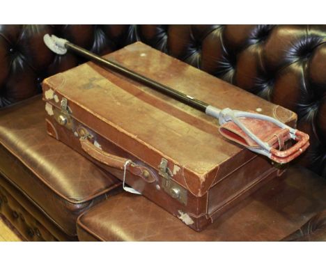 Vintage leather suitcase and shooting stick