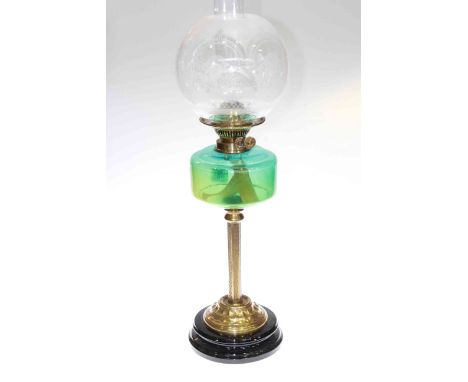 Brass column oil lamp with green glass reservoir and etched glass shade