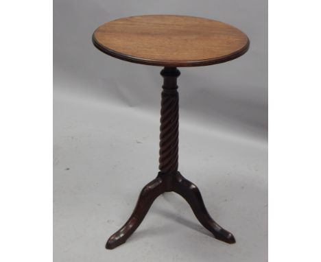 A Colonial style hardwood occasional table, the circular top on a spirally turned column and tripod base, 50cm diameter