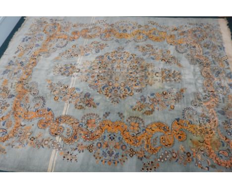 A large European carpet, with a design of flowers, scrolls, etc, on a pale blue ground,  430cm x 320cm Provenance: Butterfiel