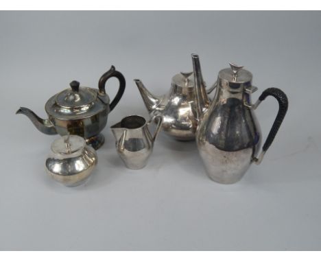 A silver plated four pieces tea set, with a crescent or anvil shaped knop, unmarked, and a silver plated teapot.