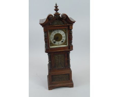 A miniature oak Continental longcase clock, inset with various bronzed metal panels, with German brass movement, 50cm high.