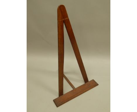 A mahogany table easel, early 20thC, 93cm high. Provenance: Butterfields, Thoresby Park, Nottinghamshire.