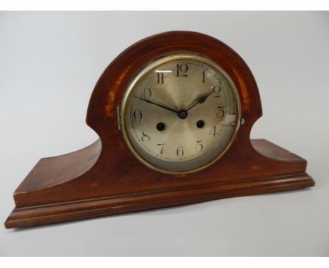 An Edwardian mahogany and marquetry mantel clock, with a silvered dial, 46cm wide
