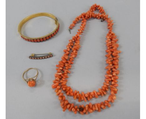 Various jewellery, to include a bangle with sections of coral, a coral ring, the pierced shank marked 375, a coral necklace e